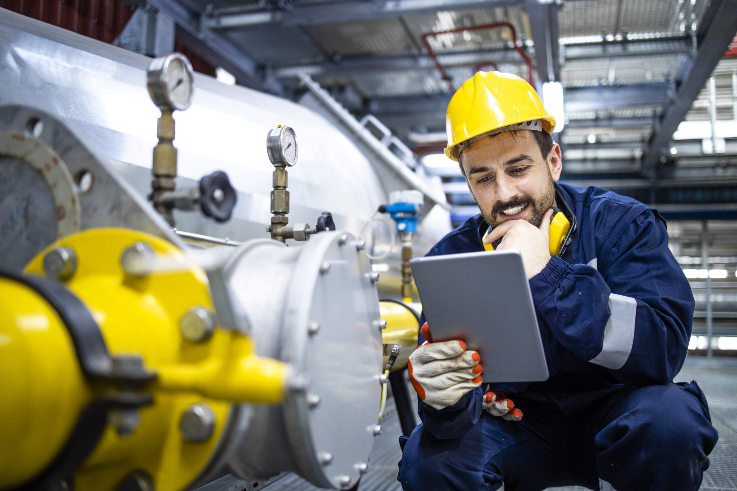 Maintenance worker inspecting equipment
